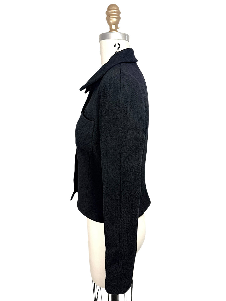 Left side profile of vintage Chanel black fitted cropped jacket with structured tailoring