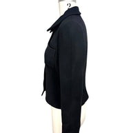Left side profile of vintage Chanel black fitted cropped jacket with structured tailoring