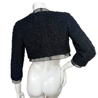Back view of Chanel cropped ruched jacket with sheer chiffon hem and textured fabric detail