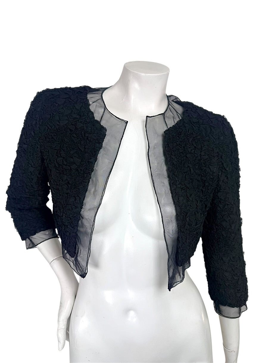 Chanel black ruched cropped bolero jacket with sheer silk chiffon neckline and open front, front view