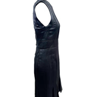 Left side profile of vintage Chanel black satin sleeveless dress with flared pleated hem.