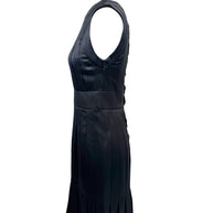 Right side profile of vintage Chanel satin pleated dress with structured silhouette and flared hem.