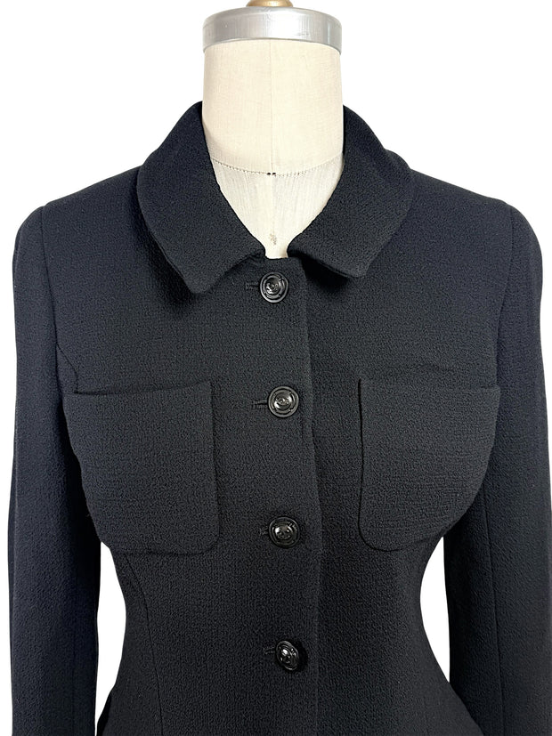 Close-up front detail of vintage Chanel black textured cropped jacket with tonal CC logo buttons