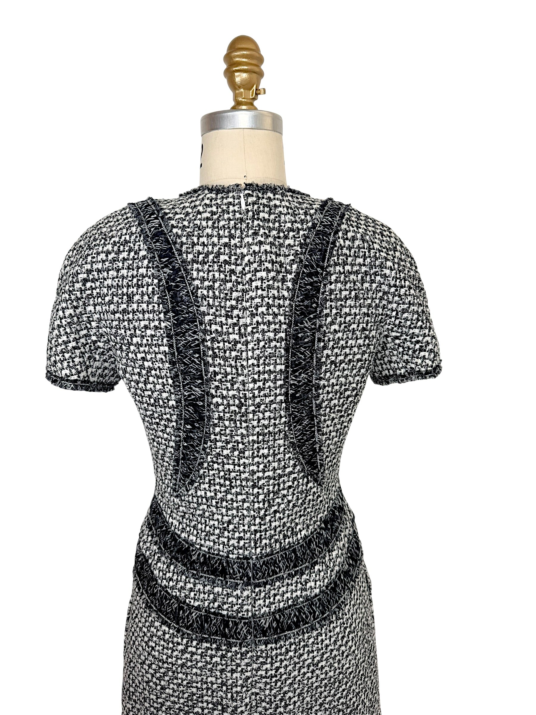 Rear detail of Chanel tweed mini dress with ribbon trim accents