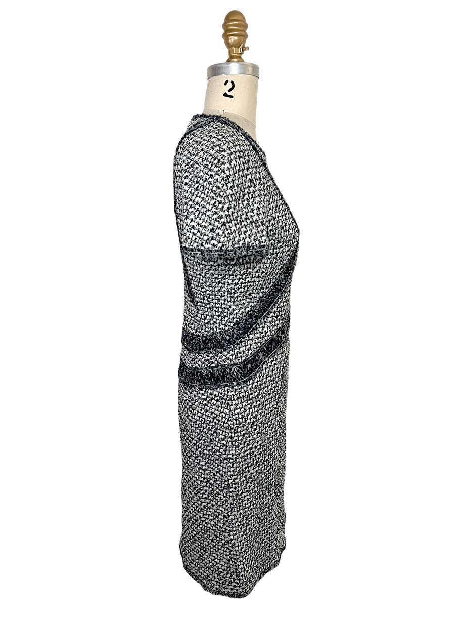 Left side profile of Chanel black and white tweed mini dress