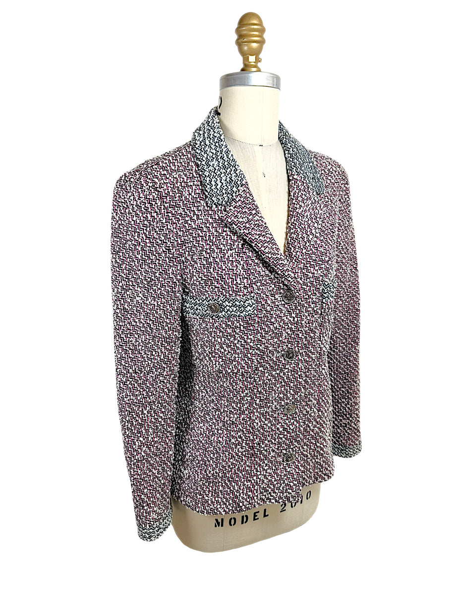Three-quarter front angle of Chanel Boutique Spring 1996 tweed jacket with fitted silhouette and contrast trim