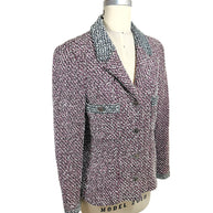 Three-quarter front angle of Chanel Boutique Spring 1996 tweed jacket with fitted silhouette and contrast trim