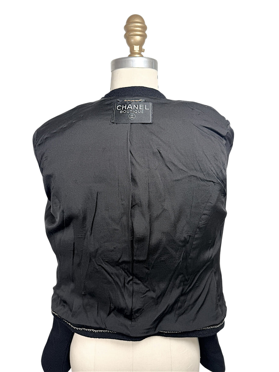 Interior lining of vintage Chanel Boutique jacket with signature weighted chain hem