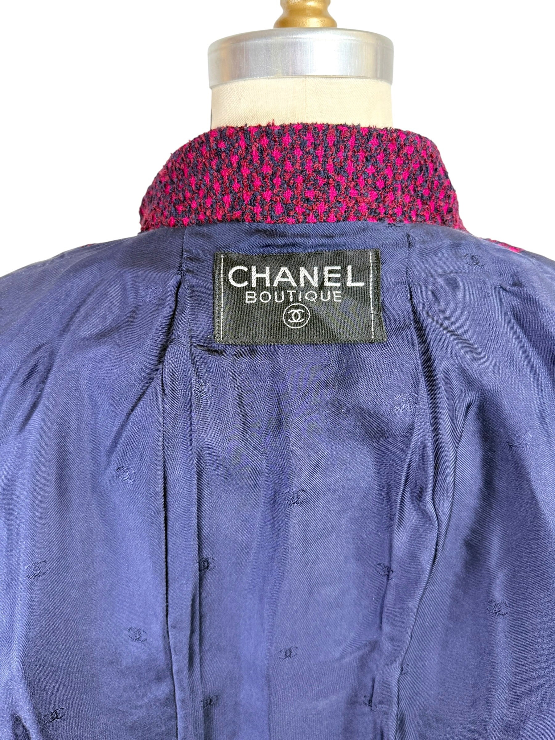 Close-up of Chanel Boutique interior label on navy silk monogram lining