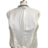 Interior silk CC logo jacquard lining of Chanel Boutique Spring 1996 tweed jacket with Chanel label visible