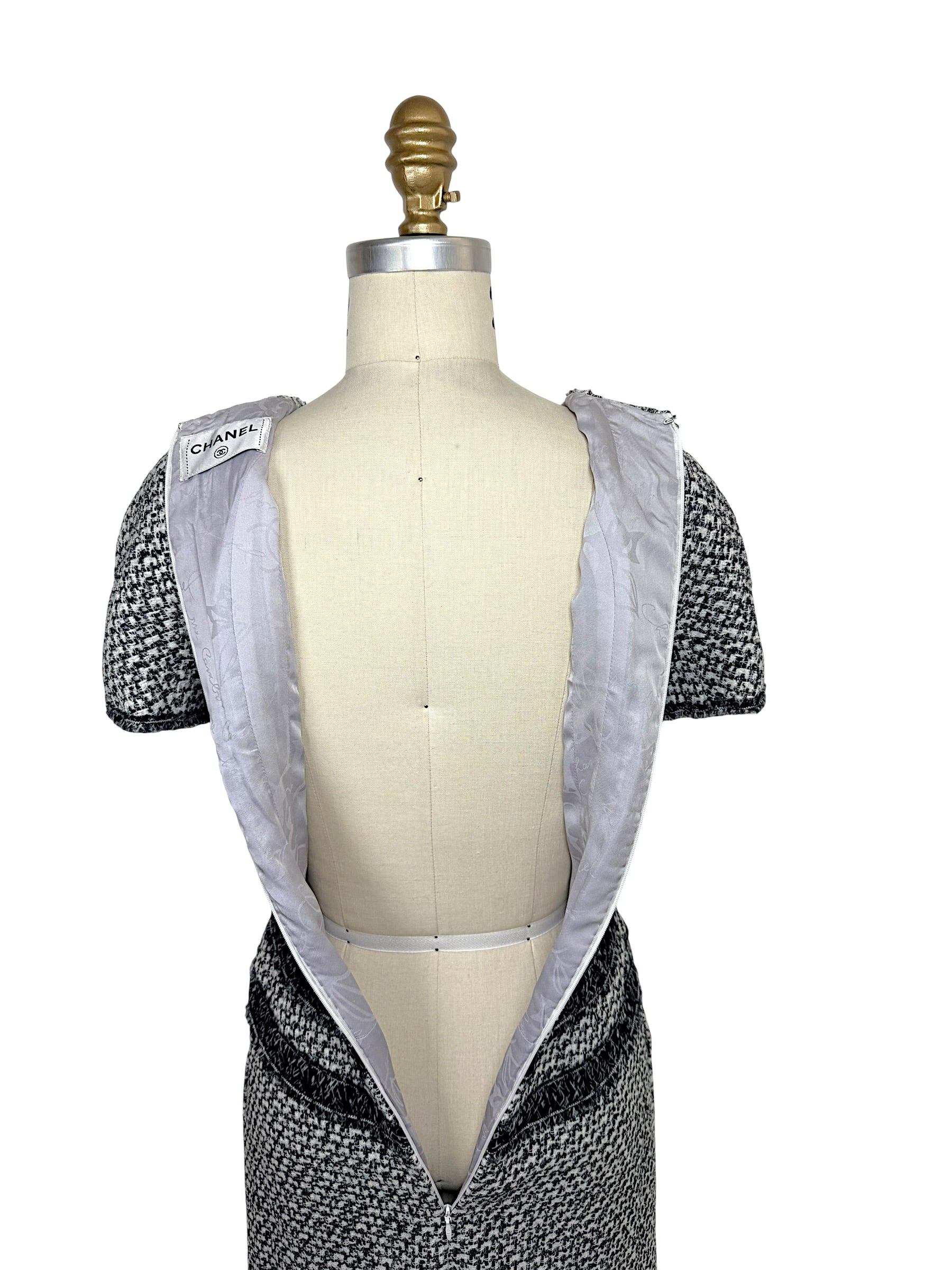 Interior camellia jacquard lining of Chanel tweed mini dress