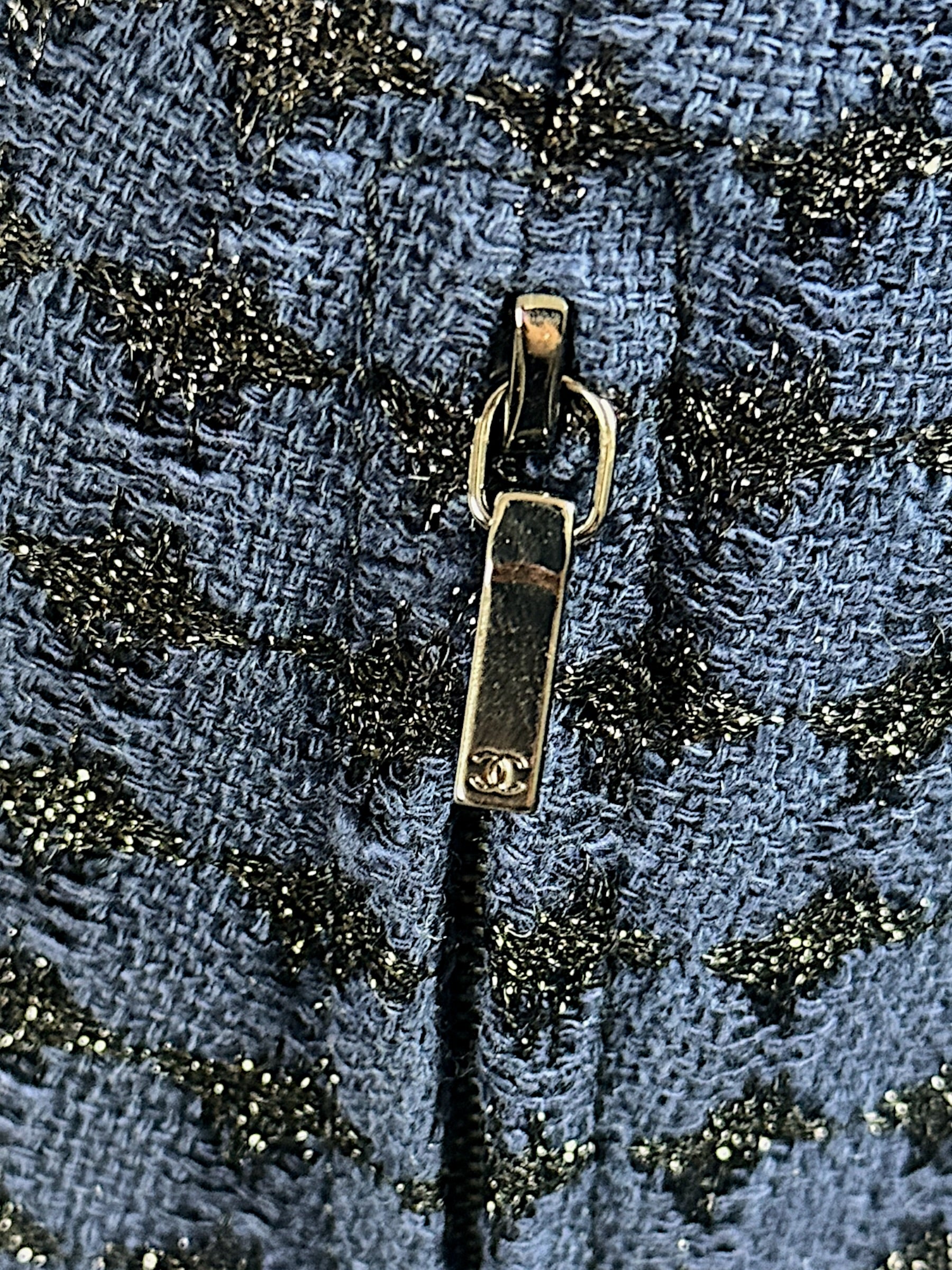 Chanel CC logo zipper pull detail on tweed jacket Spring 2016