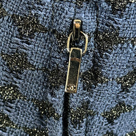 Chanel CC logo zipper pull detail on tweed jacket Spring 2016