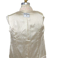 Interior of Chanel Cruise 2004 jacket featuring ivory silk lining woven with tonal camellia flowers and interlocking CC motifs.