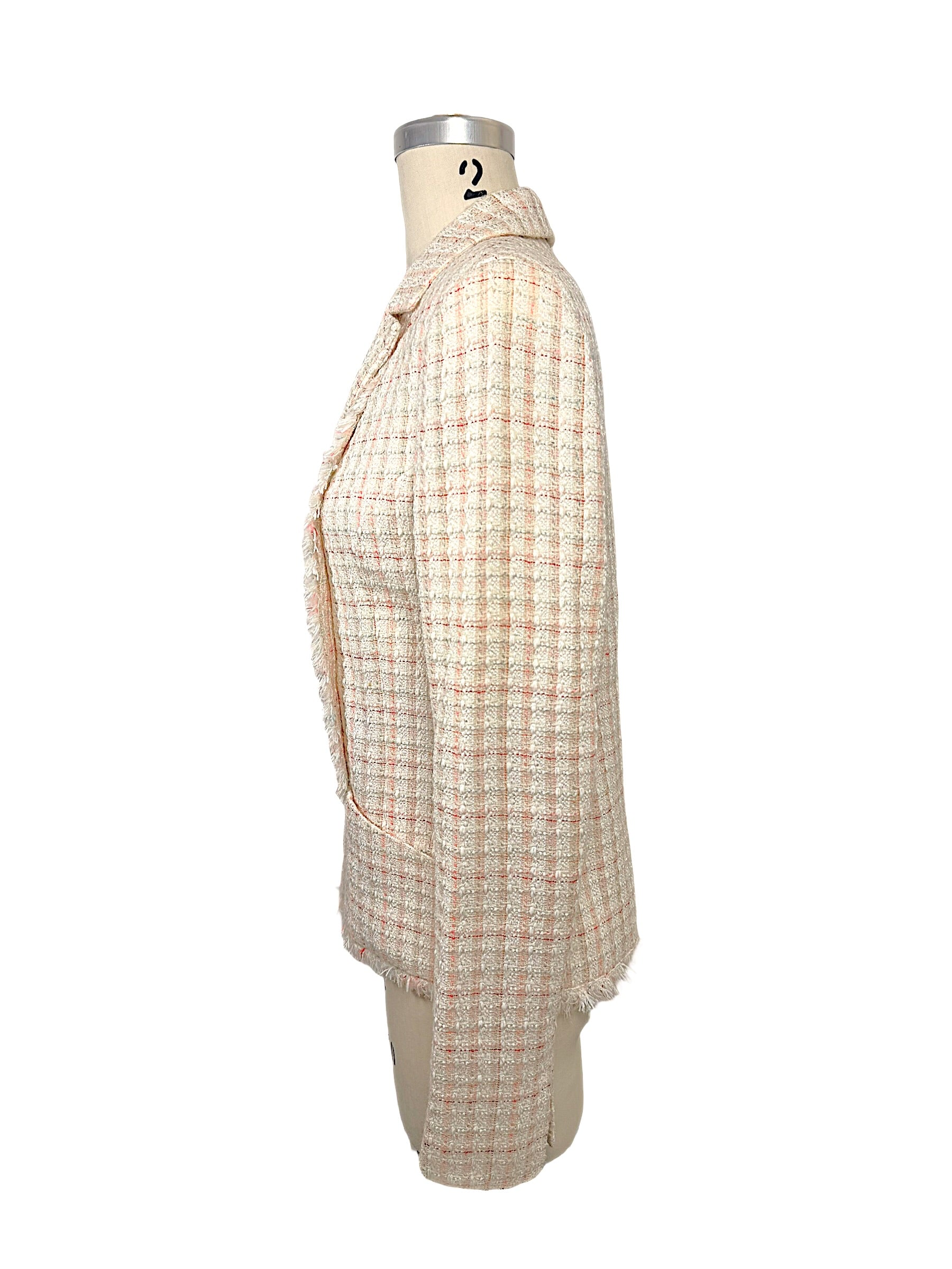 Right side profile of Chanel Cruise 2004 fantasy tweed jacket showing structured tailoring, textured bouclé fabric and elegant silhouette.