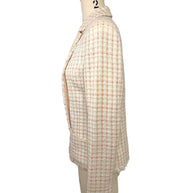 Right side profile of Chanel Cruise 2004 fantasy tweed jacket showing structured tailoring, textured bouclé fabric and elegant silhouette.