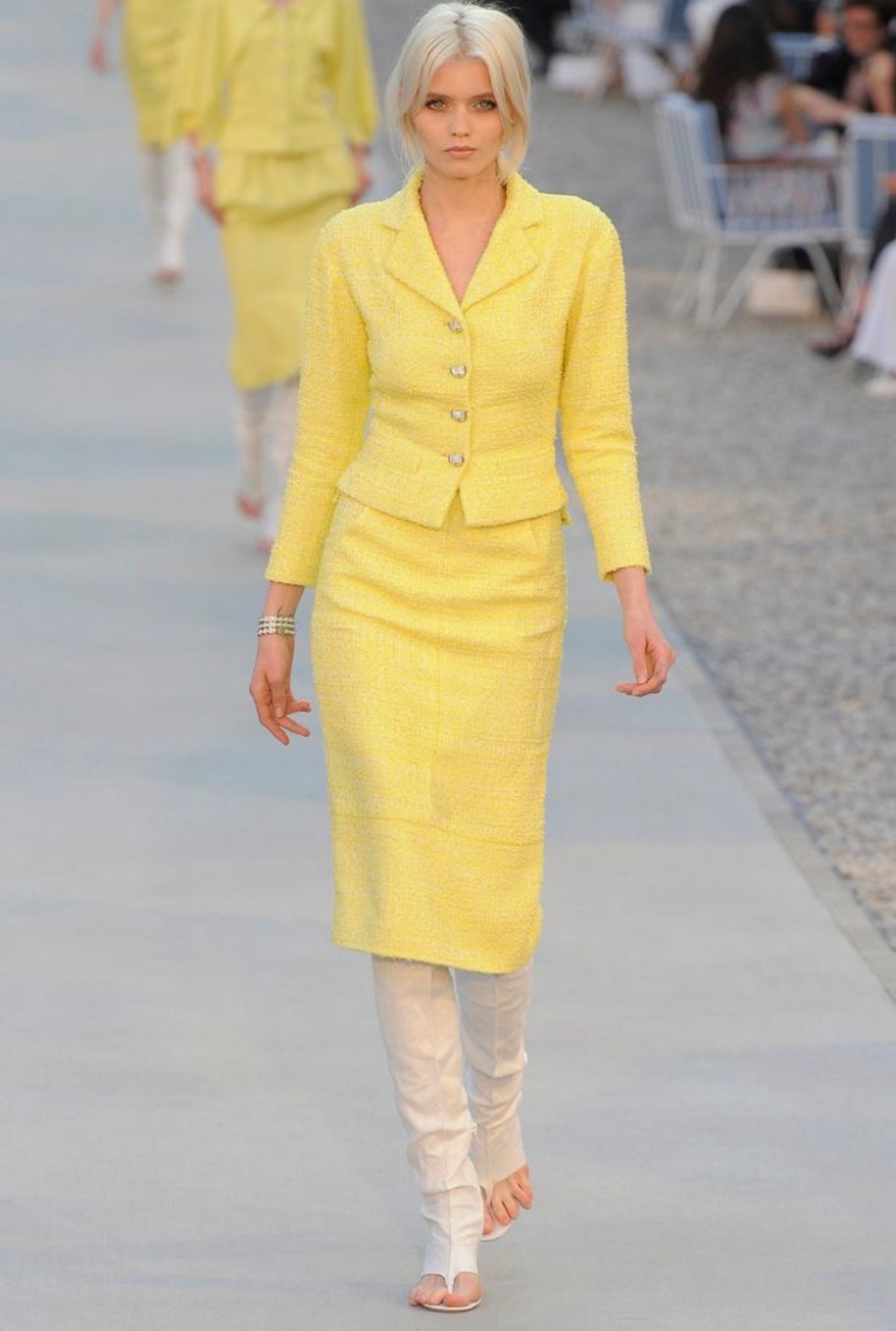 Chanel Cruise 2012 runway Look 1 featuring yellow bouclé tweed skirt suit designed by Karl Lagerfeld