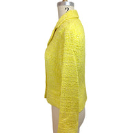 Side profile of Chanel Cruise 2012 yellow tweed fitted runway jacket with tailored waist and textured bouclé fabrication