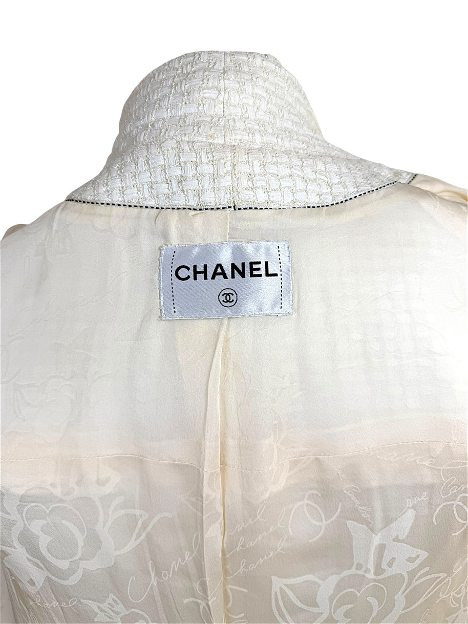 Interior Chanel label and camellia jacquard lining detail from Cruise 2014 ivory tweed jacket