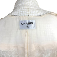 Interior Chanel label and camellia jacquard lining detail from Cruise 2014 ivory tweed jacket