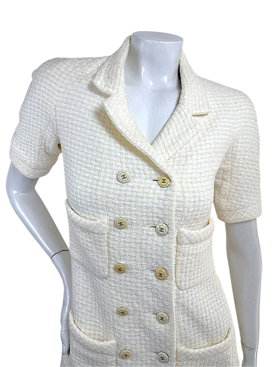 Close front view of Chanel Cruise 2014 ivory tweed jacket with signature CC logo buttons
