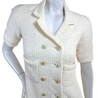 Close front view of Chanel Cruise 2014 ivory tweed jacket with signature CC logo buttons