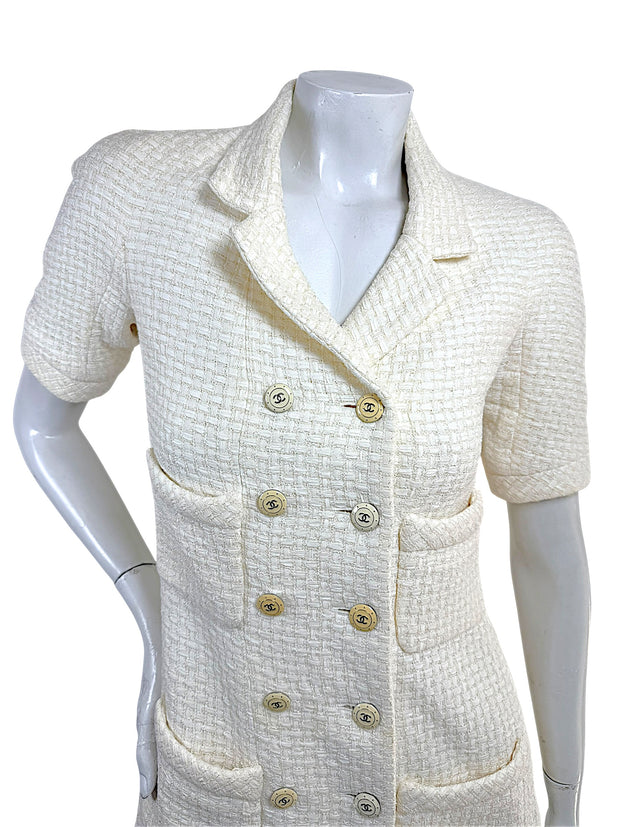 Close front view of Chanel Cruise 2014 ivory tweed jacket with signature CC logo buttons