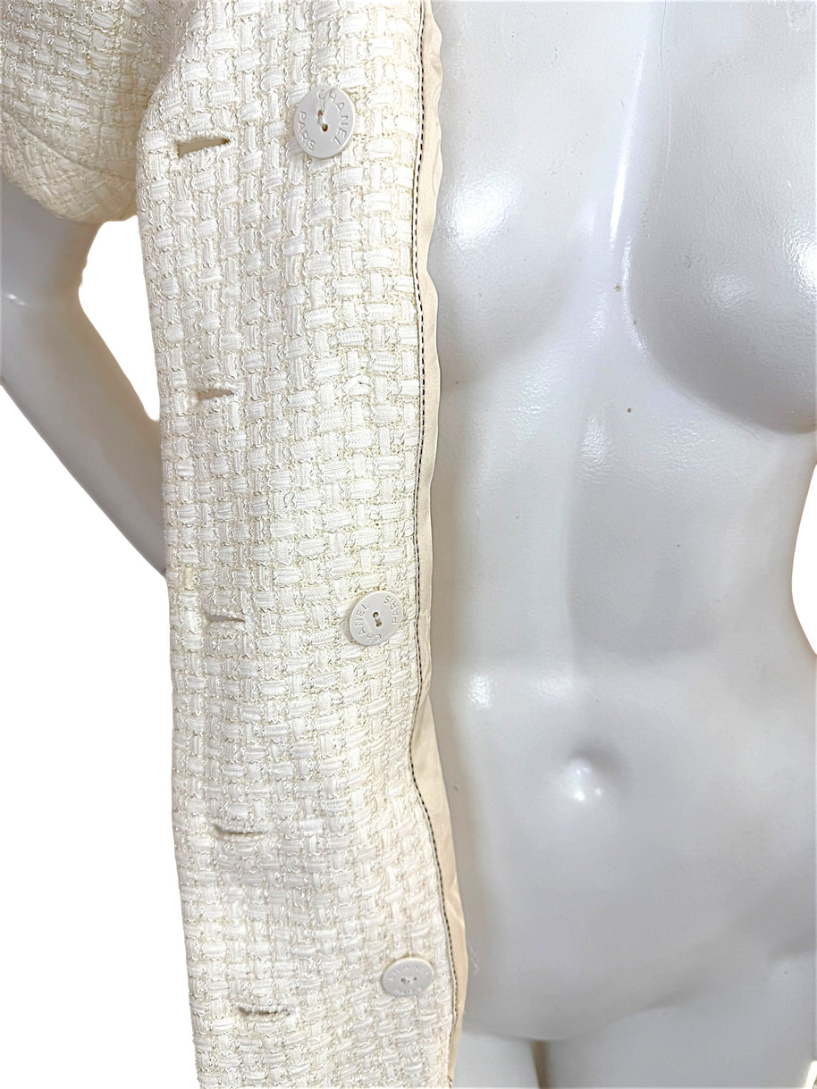 Close-up of Chanel Cruise 2014 ivory tweed jacket front placket and Chanel buttons