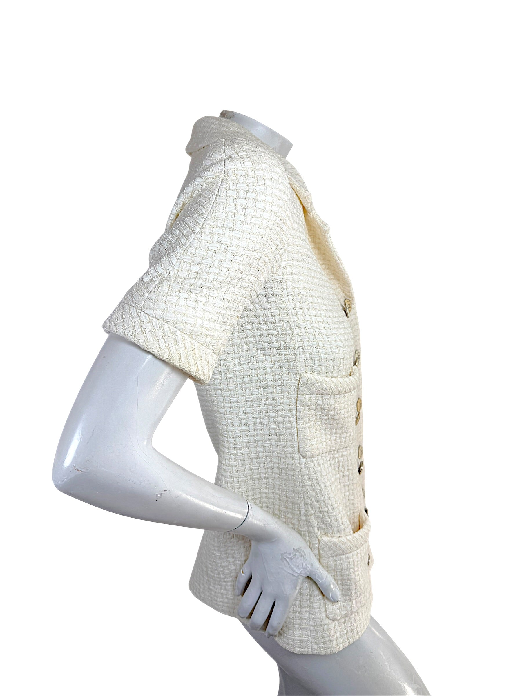 Left side profile of Chanel Cruise 2014 ivory tweed jacket with structured tailoring