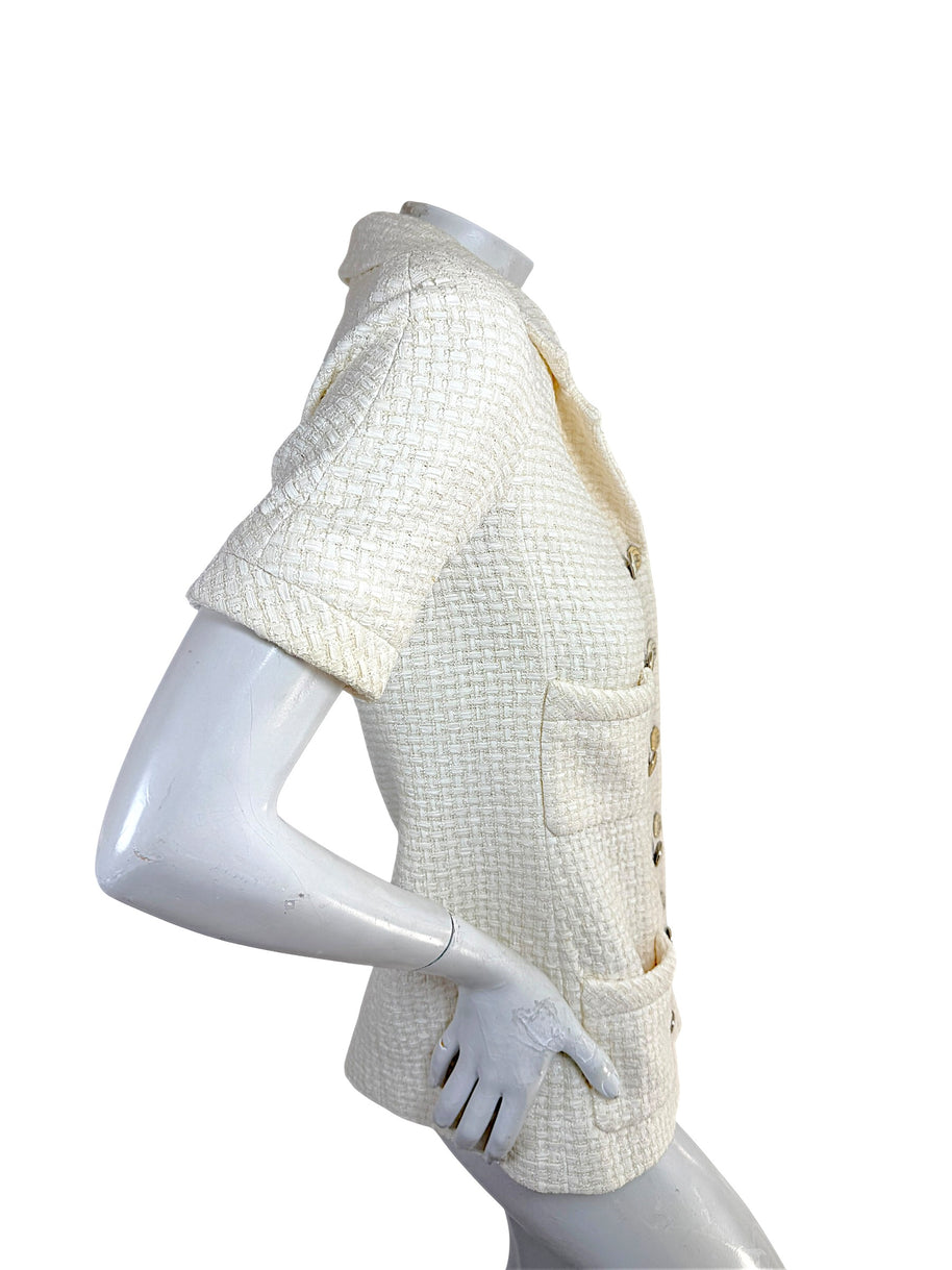 Left side profile of Chanel Cruise 2014 ivory tweed jacket with structured tailoring