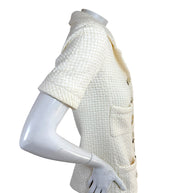 Left side profile of Chanel Cruise 2014 ivory tweed jacket with structured tailoring
