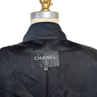 Interior view of the authentic Chanel Cruise 2017 jacket displaying the Chanel label, size 34 tag, and tonal CC jacquard silk lining.