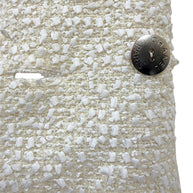 Interior silver-tone Chanel Paris logo button securing the front closure of the authentic Chanel Cruise 2019 Runway Look 26 ivory fantasy tweed jacket.
