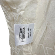 Interior production tag confirming authentic Chanel manufacture in France with style identification and French size 34.