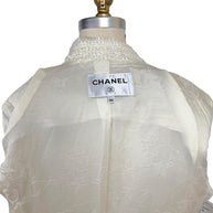 Authentic Chanel interior label identifying the Cruise 2019 runway jacket in French size 34 with signature woven branding.