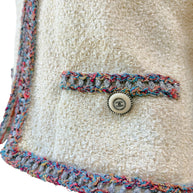 Chanel Cruise 2020 tweed jacket pocket trim and Chanel button detail