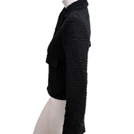 Side profile of Chanel Cruise 2021 black bouclé tweed jacket with tailored cropped fit and textured bouclé finish