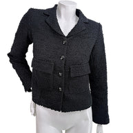 Chanel Cruise 2021 black bouclé tweed jacket front view with CC logo buttons documented from runway Look 13 alternate colorway size FR 34