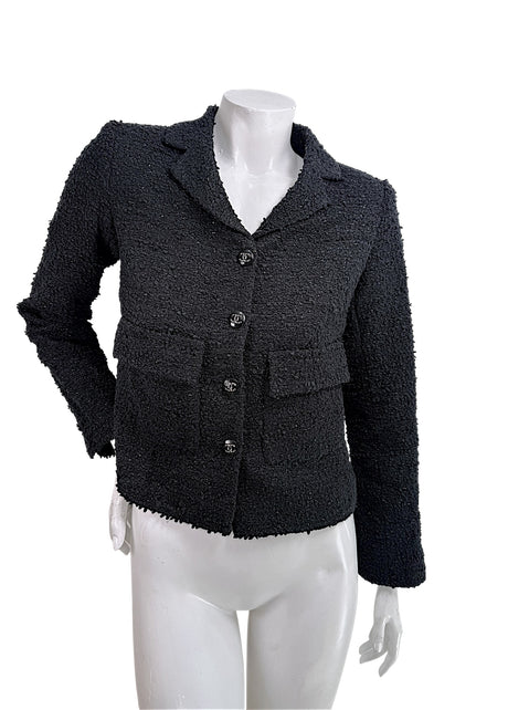 Chanel Cruise 2021 black bouclé tweed jacket front view with CC logo buttons documented from runway Look 13 alternate colorway size FR 34