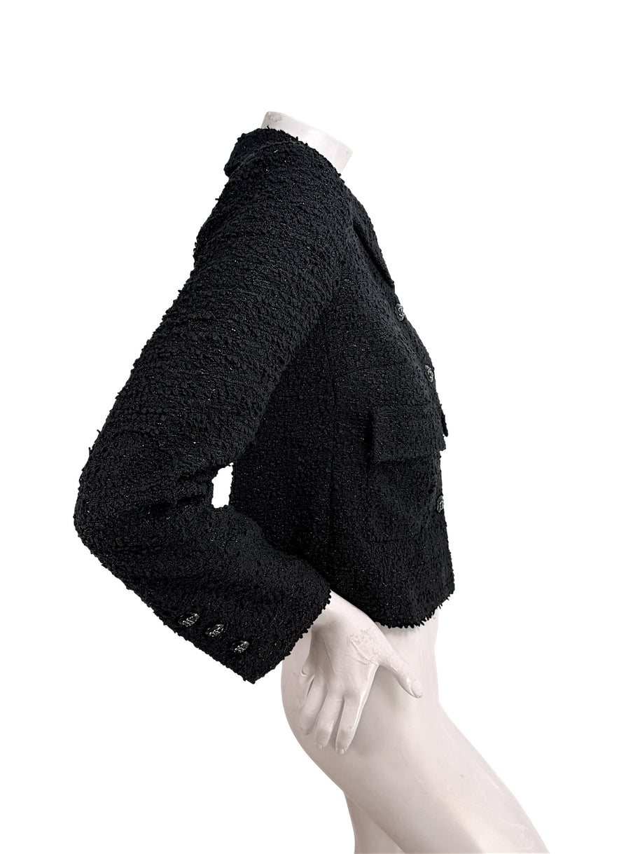 Side silhouette of Chanel Cruise 2021 black bouclé tweed jacket with cropped tailored fit