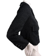 Side silhouette of Chanel Cruise 2021 black bouclé tweed jacket with cropped tailored fit