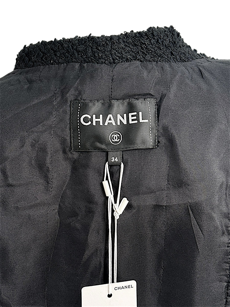 Interior Chanel neck label and size tag inside Cruise 2021 black bouclé tweed jacket