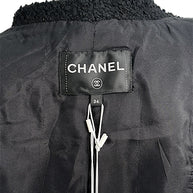Interior Chanel neck label and size tag inside Cruise 2021 black bouclé tweed jacket