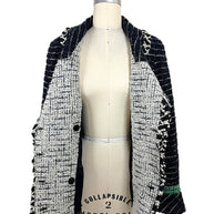 Interior construction of the Chanel Fall 2009 Runway Look 22 bouclé tweed jacket showing the reverse weave, shawl collar, and couture craftsmanship.