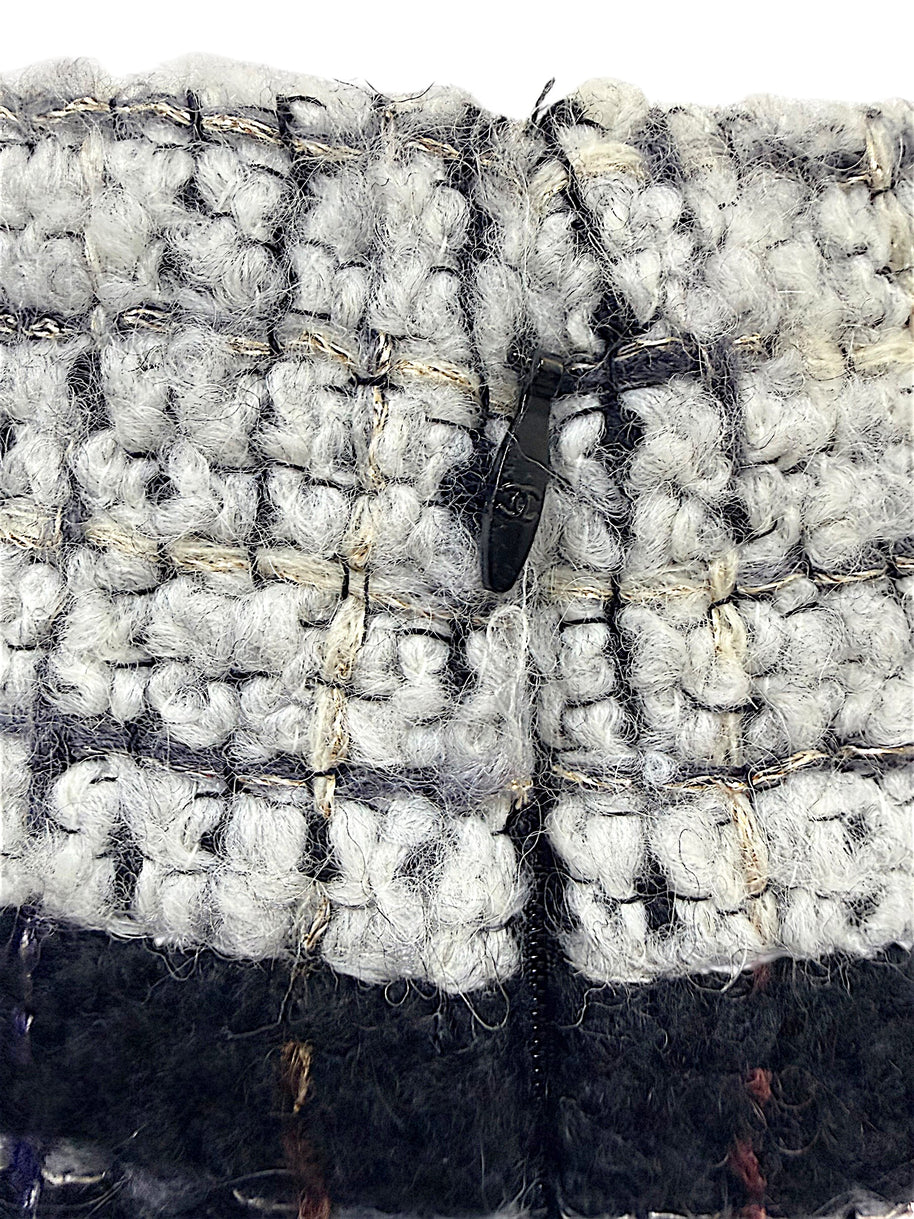 Close-up of the concealed waist hook and zipper closure on the Chanel Fall 2009 Runway Look 22 bouclé tweed skirt.