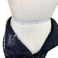 Interior view of Chanel Fall 2009 Runway Look 22 skirt showing lining, zipper closure, and Chanel label.