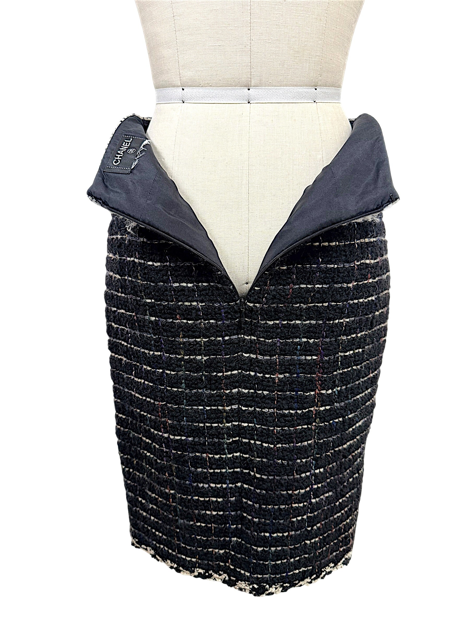 Interior view of the Chanel Fall 2009 Runway Look 22 skirt showing the Chanel label and black lining with concealed zipper closure.