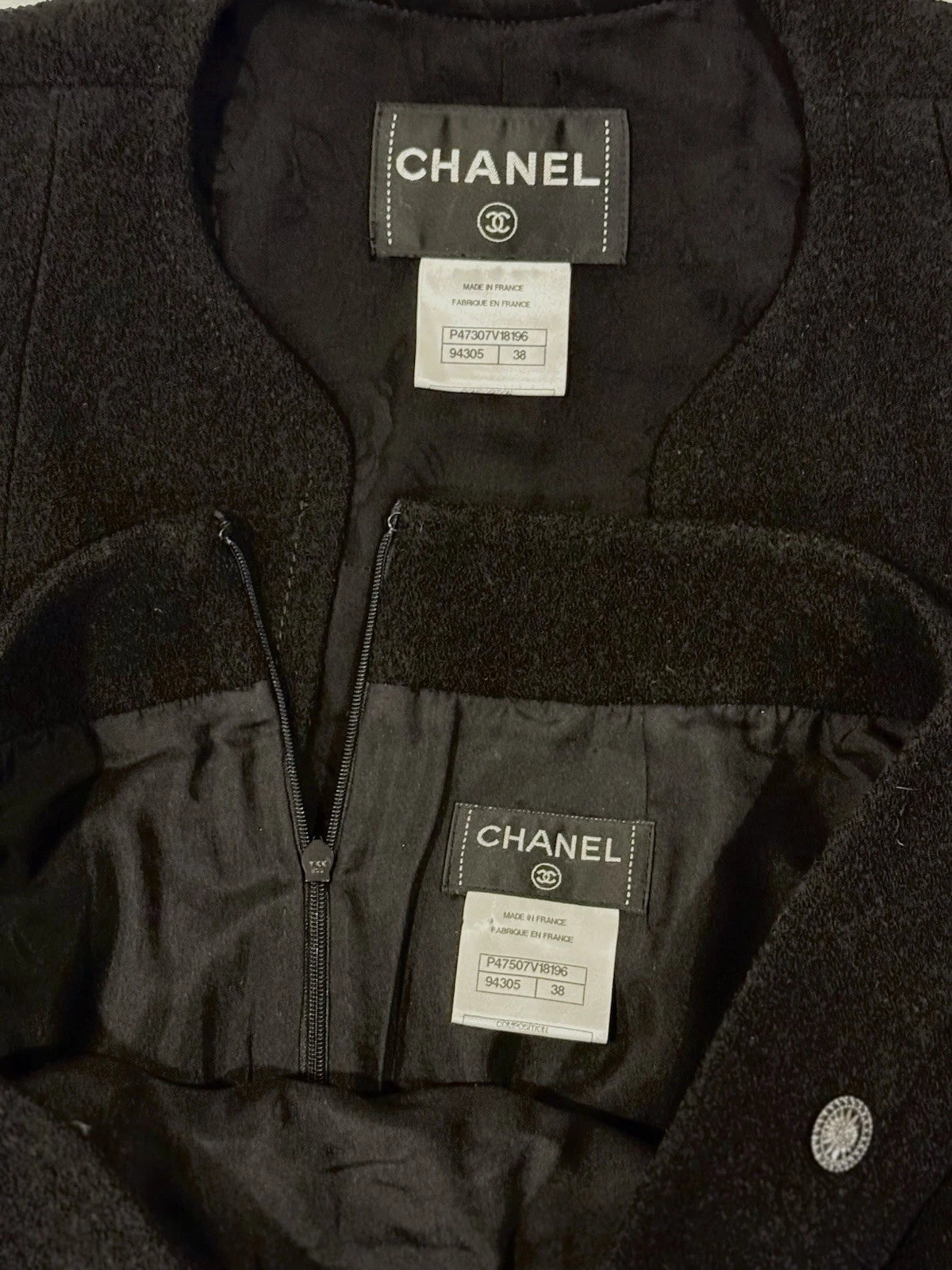 Chanel black jacket interior with Chanel label and garment tags