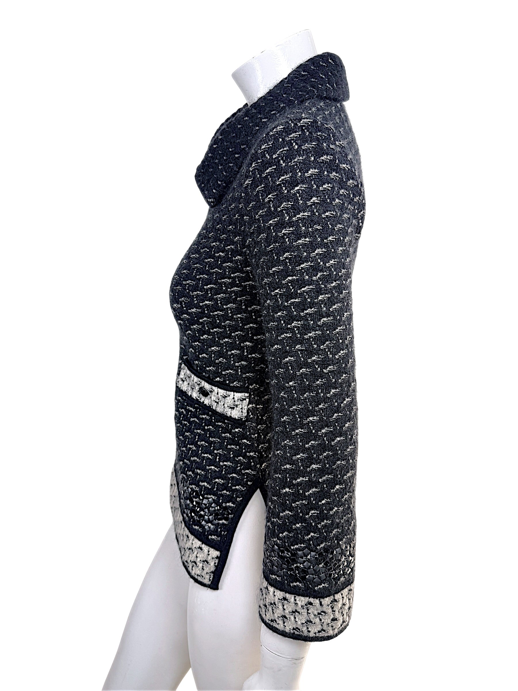 Side profile detail of Chanel Fall Winter 2010 appliqué tweed jacket with slit hem