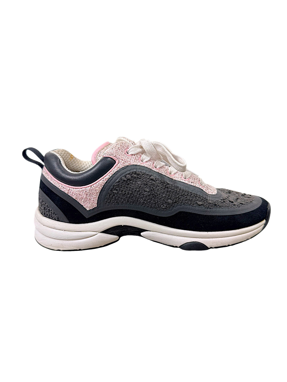 Chanel grey and pink tweed sneaker side view showing oversized tonal interlocking CC logo